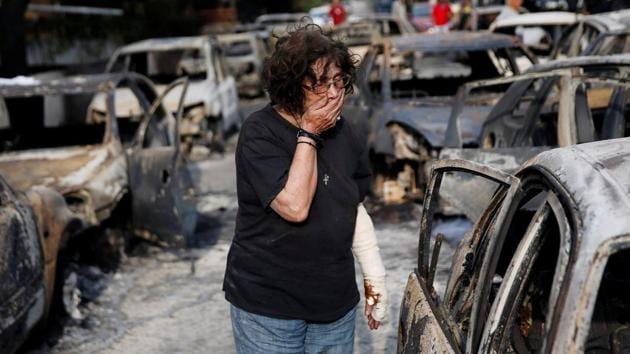 A woman breaks down while trying to find her dog following a wildfire in the village of Mati. “People are shocked, lost. Some of them have lost everything: children, parents, homes,” said Red Cross spokeswoman Georgia Trisbioti. (Costas Baltas / REUTERS) A woman breaks down while trying to find her dog following a wildfire in the village of Mati. “People are shocked, lost. Some of them have lost everything: children, parents, homes,” said Red Cross spokeswoman Georgia Trisbioti. (Costas Baltas / REUTERS)
