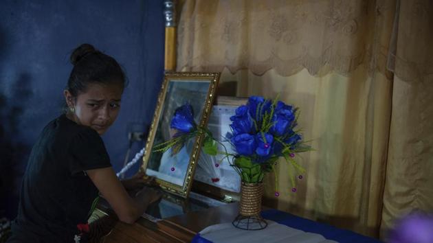 A woman cries next to coffin of Leyling Chavarria, after he was killed when police and paramilitaries attacked a barricade at the Sandino neighborhood of Jinotega, Nicaragua.(AP Photo)