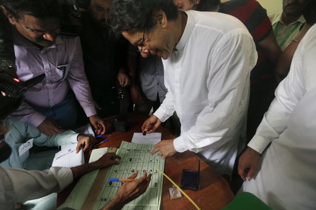 Imran Khan, chief of Pakistan Tehreek-e-Insaf party, casts his vote at a polling station in Islamabad, July 25, 2018. Khan is an untested political entity who lacks administrative experience, but the fiercely fought election has given us a peep into where he and his party – Pakistan Tehreek-e-Insaf (PTI) – stand vis a vis India. (AP) Imran Khan, chief of Pakistan Tehreek-e-Insaf party, casts his vote at a polling station in Islamabad, July 25, 2018. Khan is an untested political entity who lacks administrative experience, but the fiercely fought election has given us a peep into where he and his party – Pakistan Tehreek-e-Insaf (PTI) – stand vis a vis India. (AP)