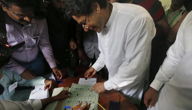 Pakistani politician Imran Khan, chief of Pakistan Tehreek-e-Insaf party, casts his vote at a polling station for the parliamentary elections in Islamabad, Pakistan, on Wednesday. (AP) Pakistani politician Imran Khan, chief of Pakistan Tehreek-e-Insaf party, casts his vote at a polling station for the parliamentary elections in Islamabad, Pakistan, on Wednesday. (AP)