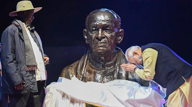 Prime Minister Narendra Modi pays tribute to Sardar Vallabhbhai Patel after unveiling his bust along with Ugandan President Yoweri Museveni (L) at an Indian community event in Kampala, Uganda. In his address, Modi lauded the contribution of the Indian community in the growth of Uganda. He thanked Museveni for re-embracing the Indian community. (PTI) Prime Minister Narendra Modi pays tribute to Sardar Vallabhbhai Patel after unveiling his bust along with Ugandan President Yoweri Museveni (L) at an Indian community event in Kampala, Uganda. In his address, Modi lauded the contribution of the Indian community in the growth of Uganda. He thanked Museveni for re-embracing the Indian community. (PTI)