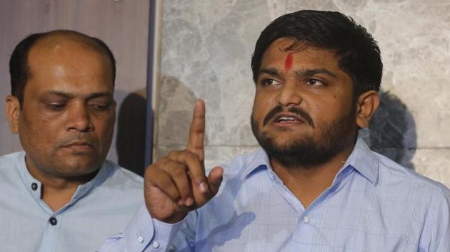 Patidar Anamat Andolan Samiti leader Hardik Patel was on Wednesday sentenced to two years imprisonment and fined Rs 50,000 by a Visnagar court for vandalism during the 2015 Patidar protests. Patel and two others were found guilty of resorting to arson and creating a ruckus at the office of BJP legislator Rushikesh Patel in Visnagar. Fellow Patidar leader Lalji Patel was also awarded a similar sentence. (Siddharaj Solanki / HT File) Patidar Anamat Andolan Samiti leader Hardik Patel was on Wednesday sentenced to two years imprisonment and fined Rs 50,000 by a Visnagar court for vandalism during the 2015 Patidar protests. Patel and two others were found guilty of resorting to arson and creating a ruckus at the office of BJP legislator Rushikesh Patel in Visnagar. Fellow Patidar leader Lalji Patel was also awarded a similar sentence. (Siddharaj Solanki / HT File)