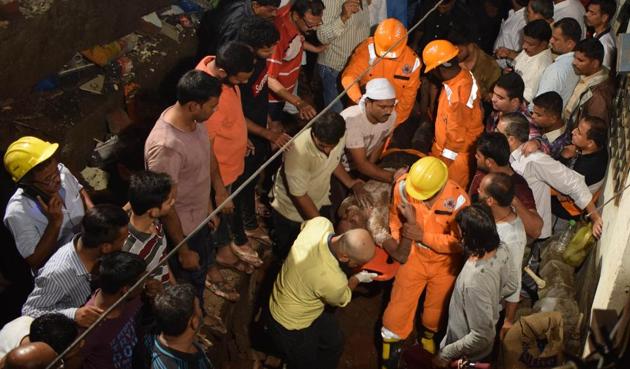 An injured being rushed to a hospital after being rescued by a team of NDRF personnel on Tuesday.(Praful Gangurde/HT)