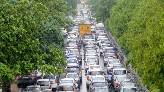Traffic jam in Noida after heavy rains lashed the city. Traffic moved at a relatively slower pace, prompting Delhi Traffic Police to issue advisories on roads best avoided. (Sunil Ghosh / HT Photo)