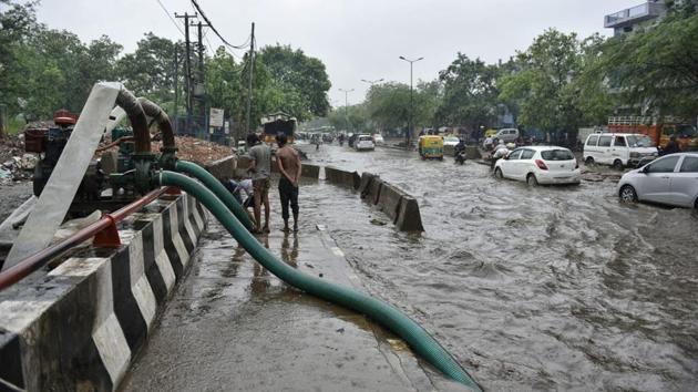 After the rains, excessive water was pumped out at Rohtak Road. This, however, is not the heaviest rainfall national capital has seen so far this season. Delhi received around 52 mm of rain on July 13. The heaviest bout of rainfall experienced by the city in the last 10 years was on July 21, 2013, when it received 123 mm in a span of 24 hours. (Sanchit Khanna / HT Photo)