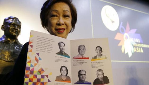 Ramon Magsaysay Award Foundation president Carmencita Abella poses with pictures of this year’s awardees, regarded as an Asian version of the Nobel Peace Prize, in Manila, Philippines, Thursday.(AP) Ramon Magsaysay Award Foundation president Carmencita Abella poses with pictures of this year’s awardees, regarded as an Asian version of the Nobel Peace Prize, in Manila, Philippines, Thursday.(AP)