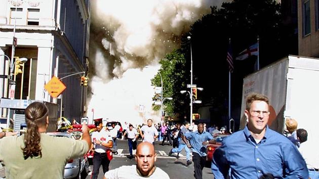 This September 11, 2001 file photo shows pedestrians running from the scene as one of the World Trade Center Towers collapses in New York City following a plane crash on the twin towers.(AFP File Photo)