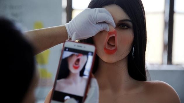 A worker takes a photo of a doll. WMDOLL said it has sold more than 20 of the AI dolls, which are priced between 10,000 yuan and 50,000 yuan ($1,470 to $7,350), compared with their annual sales of 20,000 dolls. (Aly Song / REUTERS) A worker takes a photo of a doll. WMDOLL said it has sold more than 20 of the AI dolls, which are priced between 10,000 yuan and 50,000 yuan ($1,470 to $7,350), compared with their annual sales of 20,000 dolls. (Aly Song / REUTERS)