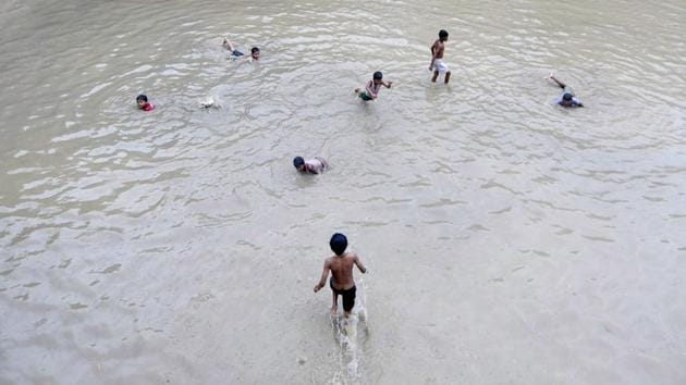 Children play on a waterlogged road near a government school in Noida’s Sector 27. Heavy rains were experienced in various parts of the country, causing blockades at several locations on Mughal Road in Poonch district. The Army has rescued 150 passengers travelling in over 40 vehicles, which got stranded due to multiple landslides on Mughal Road. (Sunil Ghosh / HT Photo) Children play on a waterlogged road near a government school in Noida’s Sector 27. Heavy rains were experienced in various parts of the country, causing blockades at several locations on Mughal Road in Poonch district. The Army has rescued 150 passengers travelling in over 40 vehicles, which got stranded due to multiple landslides on Mughal Road. (Sunil Ghosh / HT Photo)