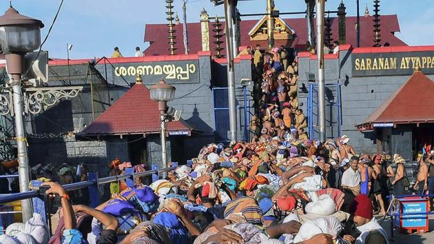 Devotees wait at Lord Ayyappa temple, in Sabarimala.(PTI file photo)