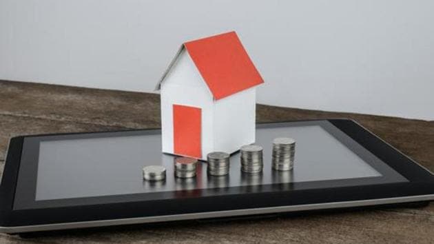 stacking coins and home model on tablet for saving with growing money to real estate owner in the future, Online marketing concept.(Getty Images/iStockphoto) stacking coins and home model on tablet for saving with growing money to real estate owner in the future, Online marketing concept.(Getty Images/iStockphoto)