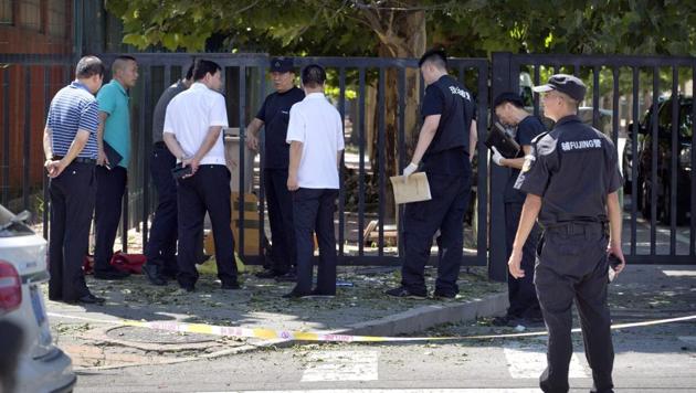 Officials and security personnel stand near the site of reported blast just south of the US Embassy in Beijing. (AP Photo) Officials and security personnel stand near the site of reported blast just south of the US Embassy in Beijing. (AP Photo)