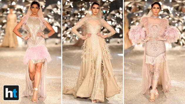 Their collection had a fair bit of dramatic feathers at cuffs, on gowns and in dupattas paired with shiny lehengas. (Raajessh Kashyap/HT Photo) Their collection had a fair bit of dramatic feathers at cuffs, on gowns and in dupattas paired with shiny lehengas. (Raajessh Kashyap/HT Photo)