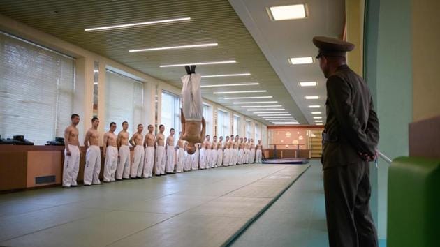 Afternoons are reserved for physical activities, with the boys screaming shouts of encouragement in the weights room of the well-equipped gym or performing impressive topless taekwondo tumbles. (Ed Jones / AFP File) Afternoons are reserved for physical activities, with the boys screaming shouts of encouragement in the weights room of the well-equipped gym or performing impressive topless taekwondo tumbles. (Ed Jones / AFP File)