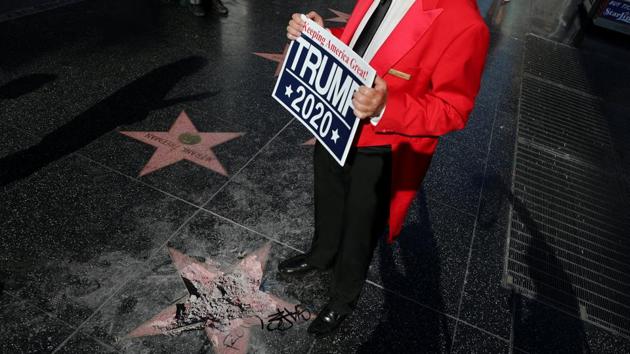 Greg Donovan, 58, stands on President Donald Trump's vandalized star on the Hollywood Walk of Fame in Hollywood,U.S on July 25, 2018. (Lucy Nicholson / REUTERS) Greg Donovan, 58, stands on President Donald Trump's vandalized star on the Hollywood Walk of Fame in Hollywood,U.S on July 25, 2018. (Lucy Nicholson / REUTERS)