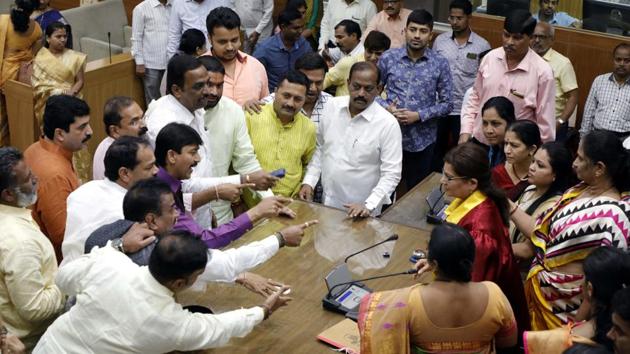 All parties staged an agitation over the issue of reservation for the Maratha community and forced the ruling party, Bharatiya Janata Party, to adjourn the general body meeting at the Pune municipal corporation. (RAHUL RAUT/HT PHOTO) All parties staged an agitation over the issue of reservation for the Maratha community and forced the ruling party, Bharatiya Janata Party, to adjourn the general body meeting at the Pune municipal corporation. (RAHUL RAUT/HT PHOTO)