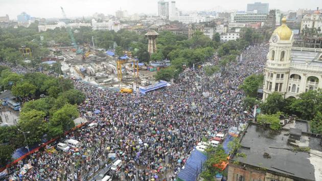 People gathered as Trinamool Congress (TMC) observes its annual Martyrs’ Day rally at Esplanade crossing in Kolkata, West Bengal, on July 21, 2018. The Martyrs’ Day rally is organised by the Trinamool Congress party every year on July 21 in the memory of 13 Youth Congress activists killed in police firing in 1993 during the Left Front regime in West Bengal. (Samir Jana / HT Photo) People gathered as Trinamool Congress (TMC) observes its annual Martyrs’ Day rally at Esplanade crossing in Kolkata, West Bengal, on July 21, 2018. The Martyrs’ Day rally is organised by the Trinamool Congress party every year on July 21 in the memory of 13 Youth Congress activists killed in police firing in 1993 during the Left Front regime in West Bengal. (Samir Jana / HT Photo)