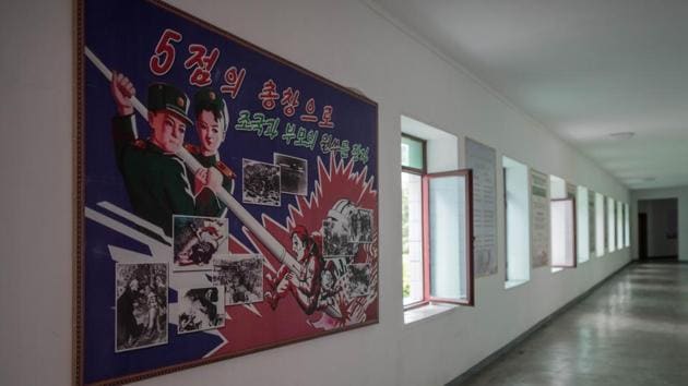 A poster depicting a US soldier being killed with a giant pen is displayed. “The Supreme Leader comrade Kim Jong Un is the true parent of all our revolutionary schoolchildren,” said Lieutenant Choe Su Gyong. The exhibits in the school museum include a rifle held up by Kim Il Sung, whom Choe quoted as saying: “The sons and daughters of the revolutionaries have to grow into flowers of the revolution, following in their parents’ footsteps.” (Ed Jones / AFP) A poster depicting a US soldier being killed with a giant pen is displayed. “The Supreme Leader comrade Kim Jong Un is the true parent of all our revolutionary schoolchildren,” said Lieutenant Choe Su Gyong. The exhibits in the school museum include a rifle held up by Kim Il Sung, whom Choe quoted as saying: “The sons and daughters of the revolutionaries have to grow into flowers of the revolution, following in their parents’ footsteps.” (Ed Jones / AFP)