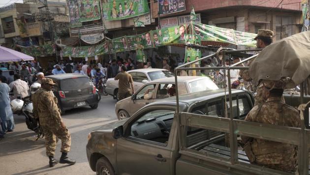 Pakistan Army troops stand alert outside a polling stations as polls closed in Rawalpindi, Pakistan. (AP Photo) Pakistan Army troops stand alert outside a polling stations as polls closed in Rawalpindi, Pakistan. (AP Photo)