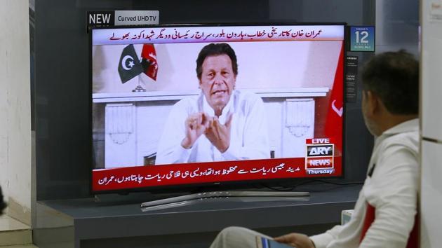 Cricket star-turned-politician Imran Khan, chairman of Pakistan Tehreek-e-Insaf, gives a speech as he declares victory in the general election in Islamabad, Pakistan.(AP Photo)