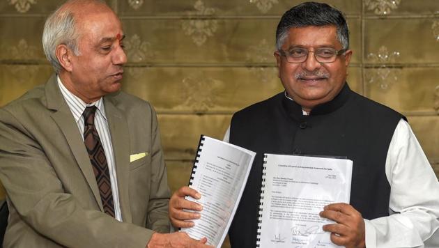 Union law minister Ravi Shankar Prasad accepts a report on 'Data Protection Framework' from Justice BN Srikrishna, in New Delhi on July 27.(PTI Photo)