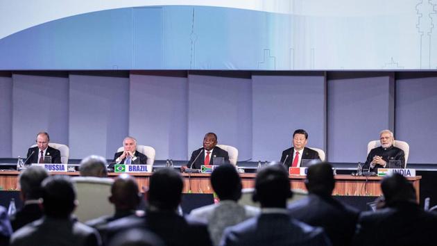 (L to R) Russian President Vladimir Putin, Brazilian President Michel Temer, South African President Cyril Ramaphosa, Chinese President Xi Jinping and Indian Prime Minister Narendra Modi presided over the BRICS outreach program meeting during the 10th BRICS summit in Johannesburg, South Africa. (Gianluigi Guercia / AFP) (L to R) Russian President Vladimir Putin, Brazilian President Michel Temer, South African President Cyril Ramaphosa, Chinese President Xi Jinping and Indian Prime Minister Narendra Modi presided over the BRICS outreach program meeting during the 10th BRICS summit in Johannesburg, South Africa. (Gianluigi Guercia / AFP)