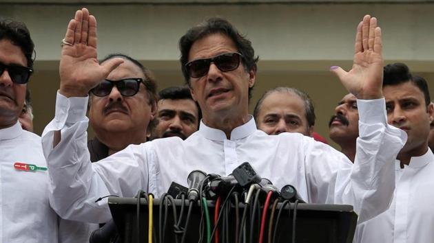 Cricket star-turned-politician Imran Khan, chairman of Pakistan Tehreek-e-Insaf (PTI), speaks to members of media after casting his vote at a polling station during the general election in Islamabad, Pakistan, July 25, 2018. (REUTERS) Cricket star-turned-politician Imran Khan, chairman of Pakistan Tehreek-e-Insaf (PTI), speaks to members of media after casting his vote at a polling station during the general election in Islamabad, Pakistan, July 25, 2018. (REUTERS)