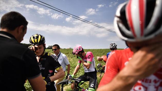 Riders clean their eyes after tear gas was used during a farmers' protest who attempted to block the stage's route, during the 16th stage of the 105th edition of the Tour de France cycling race on July 24, 2018. (Marco Bertorello / AFP) Riders clean their eyes after tear gas was used during a farmers' protest who attempted to block the stage's route, during the 16th stage of the 105th edition of the Tour de France cycling race on July 24, 2018. (Marco Bertorello / AFP)