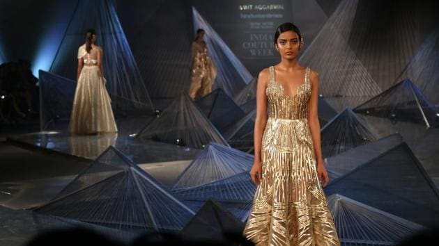 Aggarwal once again opened up new possibilities for fashion’s future with tantalising shapes (controlled swoops of volume, classically glam drapes, structured sleeves) and hues (a line-up of bold jewel tones, as well as softer pearls, golds, glacier greens, smoky purples). (Amal KS/HT Photo) 