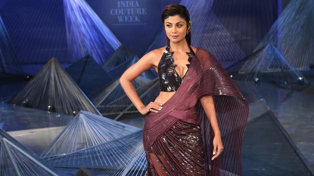 Shilpa Shetty Kundra wore a fierce, futuristic saree as the showstopper for fashion designer Amit Aggarwal’s debut show at the India Couture Week 2018 in Delhi on Friday. (Amal KS/HT Photo) Shilpa Shetty Kundra wore a fierce, futuristic saree as the showstopper for fashion designer Amit Aggarwal’s debut show at the India Couture Week 2018 in Delhi on Friday. (Amal KS/HT Photo)