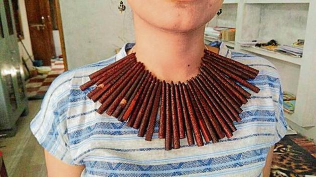 A Partridge whistle choker necklace sits pretty on a model’s neck. (Image courtesy: LAST WILDERNESS FOUNDATION) A Partridge whistle choker necklace sits pretty on a model’s neck. (Image courtesy: LAST WILDERNESS FOUNDATION)