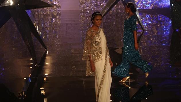 Varma’s collection also included many stunning sarees. This muted design of this cream coloured saree is complemented with a heavy zardozi cape blouse (Amal KS/HT Photo) Varma’s collection also included many stunning sarees. This muted design of this cream coloured saree is complemented with a heavy zardozi cape blouse (Amal KS/HT Photo)