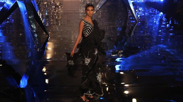 Check out this black number with exquisite zardozi work. (Amal KS/HT Photo) Check out this black number with exquisite zardozi work. (Amal KS/HT Photo)