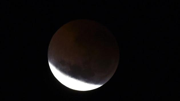A total lunar eclipse is seen in Perth on July 28.(AFP Photo) A total lunar eclipse is seen in Perth on July 28.(AFP Photo)