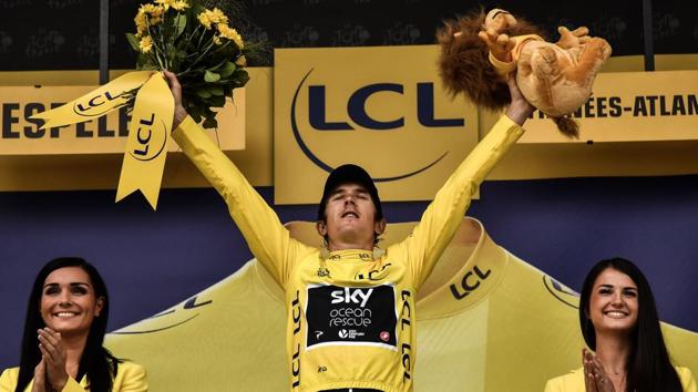 Great Britain's Geraint Thomas, wearing the overall leader's yellow jersey, celebrates on the podium after the 20th stage of the 105th edition of the Tour de France. (AFP) Great Britain's Geraint Thomas, wearing the overall leader's yellow jersey, celebrates on the podium after the 20th stage of the 105th edition of the Tour de France. (AFP)