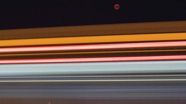 A bus passes by as the eclipse seen above the skyline of Frankfurt am Main, western Germany. The total eclipse lasted 1 hour, 42 minutes and 57 seconds, though a partial eclipse preceded and followed. (Yann Schreiber / AFP)