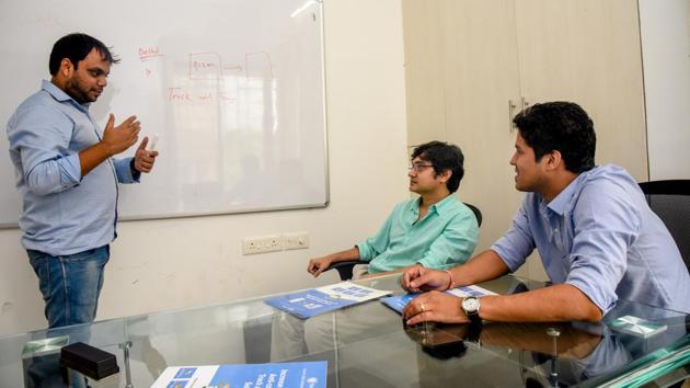 (From L-R) Yogesh Miharia, Nitin Gupta, Abhishek Agrawal at their office in Baner on Friday.(Sanket Wankhade/HT PHOTO)