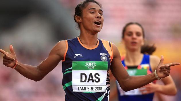 Hima Das celebrates after winning gold in the final of the women's 400m on day three of the IAAF World U20 Championships.(PTI)