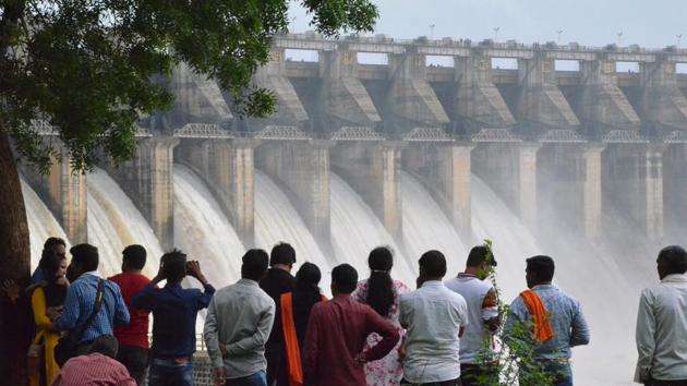 People watch water pour out of seven of 21 gates of the Bargi Dam that were opened after excess rain in Jabalpur, Madhya Pradesh. In Himachal Pradesh, sudden release of water from the 243-megawatt Kashanghydel power project in Kinnuar caused immense damage to apple orchards and pine forests in the tribal district. (AFP) People watch water pour out of seven of 21 gates of the Bargi Dam that were opened after excess rain in Jabalpur, Madhya Pradesh. In Himachal Pradesh, sudden release of water from the 243-megawatt Kashanghydel power project in Kinnuar caused immense damage to apple orchards and pine forests in the tribal district. (AFP)