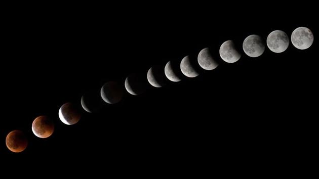 This combination of 14 pictures put together in photoshop and taken yesterday, shows the moon during a total lunar eclipse near to La Puente town, canary Spanish island of Tenerife. NASA, meanwhile, called out social media hoaxers claiming that Mars would appear as big as the moon during the eclipse. “If that were true, we’d be in big trouble given the gravitational pulls on Earth, Mars, and our moon!” the NASA website stated. (Desiree Martin / AFP)