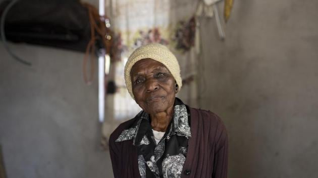 Ellis Ndlovu, 91, poses for a portrait in her Simbumbumbu, Zimbabwe home. Ndlovu's son, Edwel, was killed 34 years ago by Zimbabwe army soldiers in what many called the Matabeleland Massacres.(AP Photo)