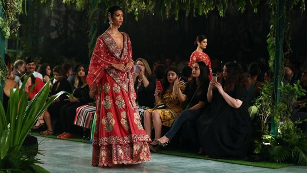 Intricate resham thread work took center stage through clustering palms, budding lotuses, miniature carnations and complex geometrical patterns inspired from Mughal architecture and miniature paintings. (jasjeet plaha/ht photo) Intricate resham thread work took center stage through clustering palms, budding lotuses, miniature carnations and complex geometrical patterns inspired from Mughal architecture and miniature paintings. (jasjeet plaha/ht photo)
