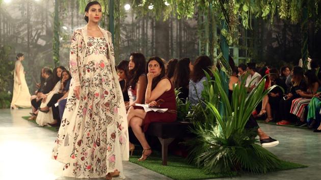 Mishra merged the past with the present in a bevy of unique Mughal era architecture-inspired lehengas, sarees, floor-grazing jackets, anarkalis and capes embellished with dizzying geometric and floral motifs in a spectrum of colours. (jasjeet plaha/ht photo) Mishra merged the past with the present in a bevy of unique Mughal era architecture-inspired lehengas, sarees, floor-grazing jackets, anarkalis and capes embellished with dizzying geometric and floral motifs in a spectrum of colours. (jasjeet plaha/ht photo)