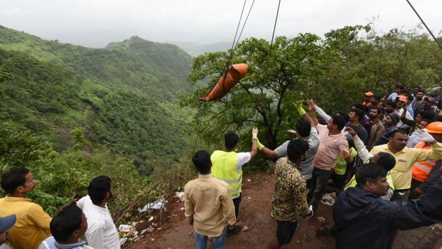 The police, fire brigade, teams of the National Disaster Response Force (NDRF) and local trekkers were making efforts to pull out all bodies from the accident spot. (Pratham Gokhale/HT Photo) 