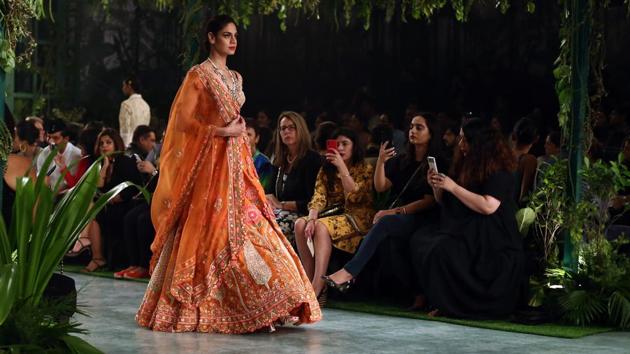 Mishra’s explosive usage of bright colours was made glamorous via luxe details, like Swarovski crystals and regal zardozi. (jasjeet plaha/ht photo) Mishra’s explosive usage of bright colours was made glamorous via luxe details, like Swarovski crystals and regal zardozi. (jasjeet plaha/ht photo)
