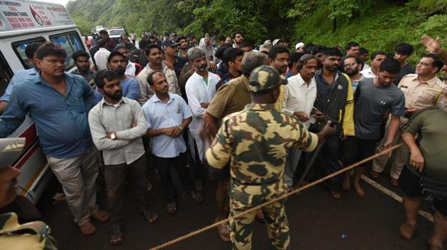 The private bus was carrying 34 staff members of the Balasaheb Sawant Konkan Krishi Vidyapeeth at Dapoli on a picnic when it fell into the 500-feet deep gorge at Ambenali Ghat on Saturday. (Pratham Gokhale/HT Photo)