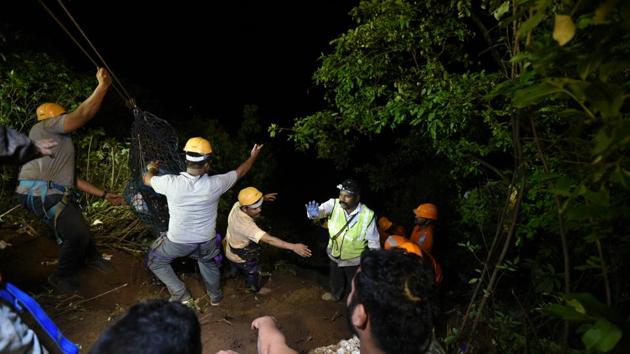 As the gorge is over 500-feet deep and located off a slippery road, the search teams were finding it difficult to retrieve the bodies. (Pratham Gokhale/HT Photo)