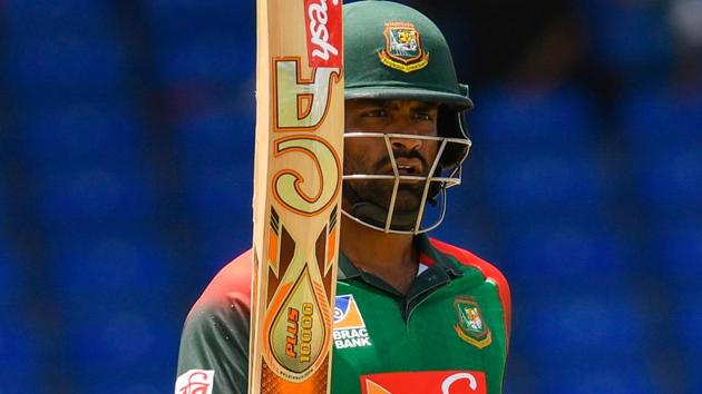 Tamim Iqbal of Bangladesh celebrates his century during the 3rd and final ODI match against West Indies.(AFP)