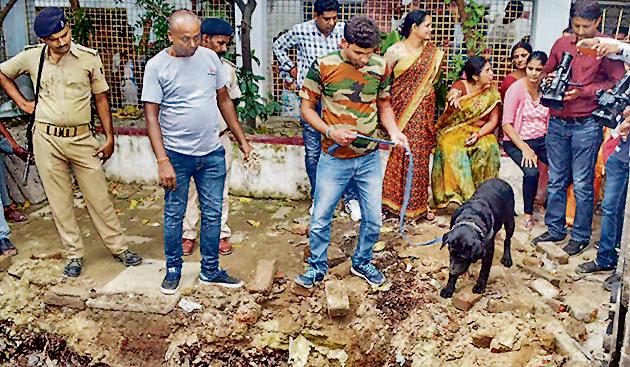 Muzaffarpur: Police with their sniffer dogs investigate the site where a rape victim was allegedly buried, at a government shelter home in Muzaffarpur, on Monday, July 23, 2018. A girl of the home has alleged that one of her fellow inmates was beaten to death and buried at the premises of the facility, and several were raped. (PTI) Muzaffarpur: Police with their sniffer dogs investigate the site where a rape victim was allegedly buried, at a government shelter home in Muzaffarpur, on Monday, July 23, 2018. A girl of the home has alleged that one of her fellow inmates was beaten to death and buried at the premises of the facility, and several were raped. (PTI)
