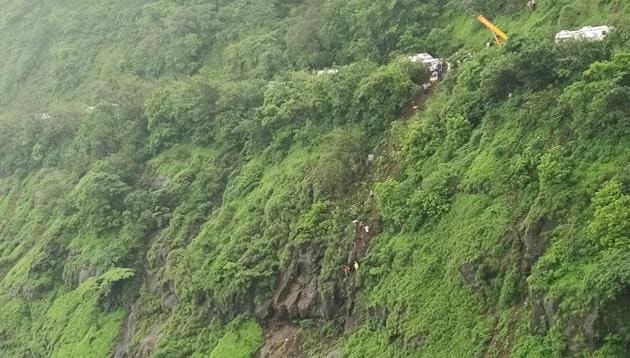 Rescuers work at the site of an accident in Raigad district in Maharashtra on July 28. (AP Photo) Rescuers work at the site of an accident in Raigad district in Maharashtra on July 28. (AP Photo)